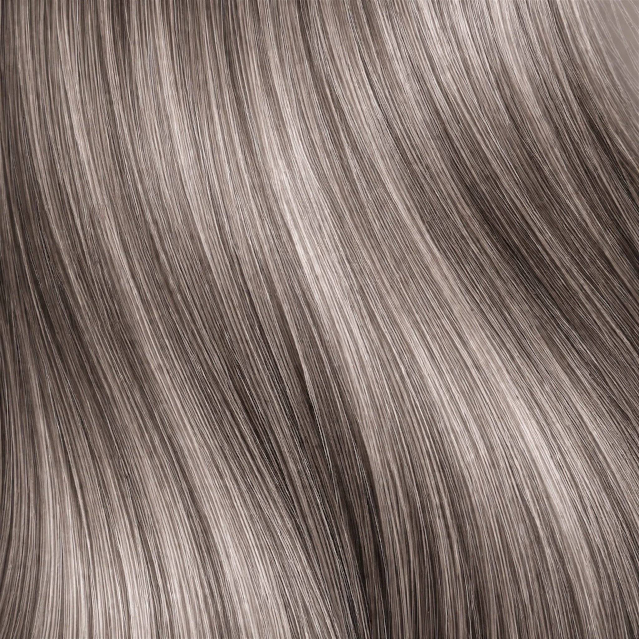 Close-up of smokey, ashy blonde air strands.
