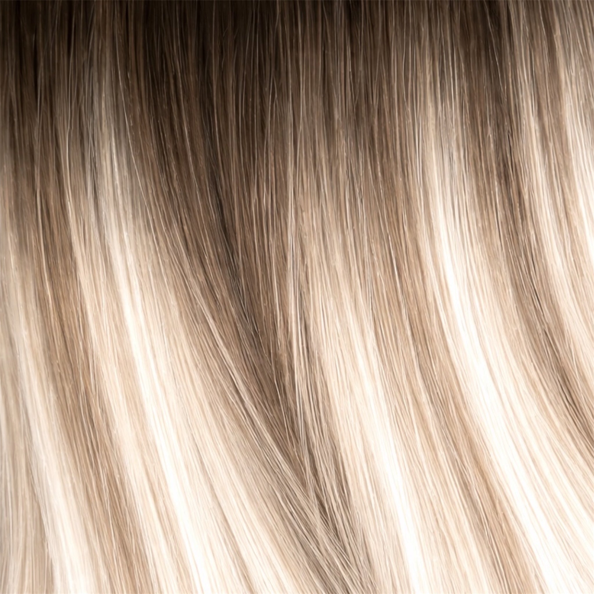 Close-up of blonde hair strands with a gradient from light to dark.
