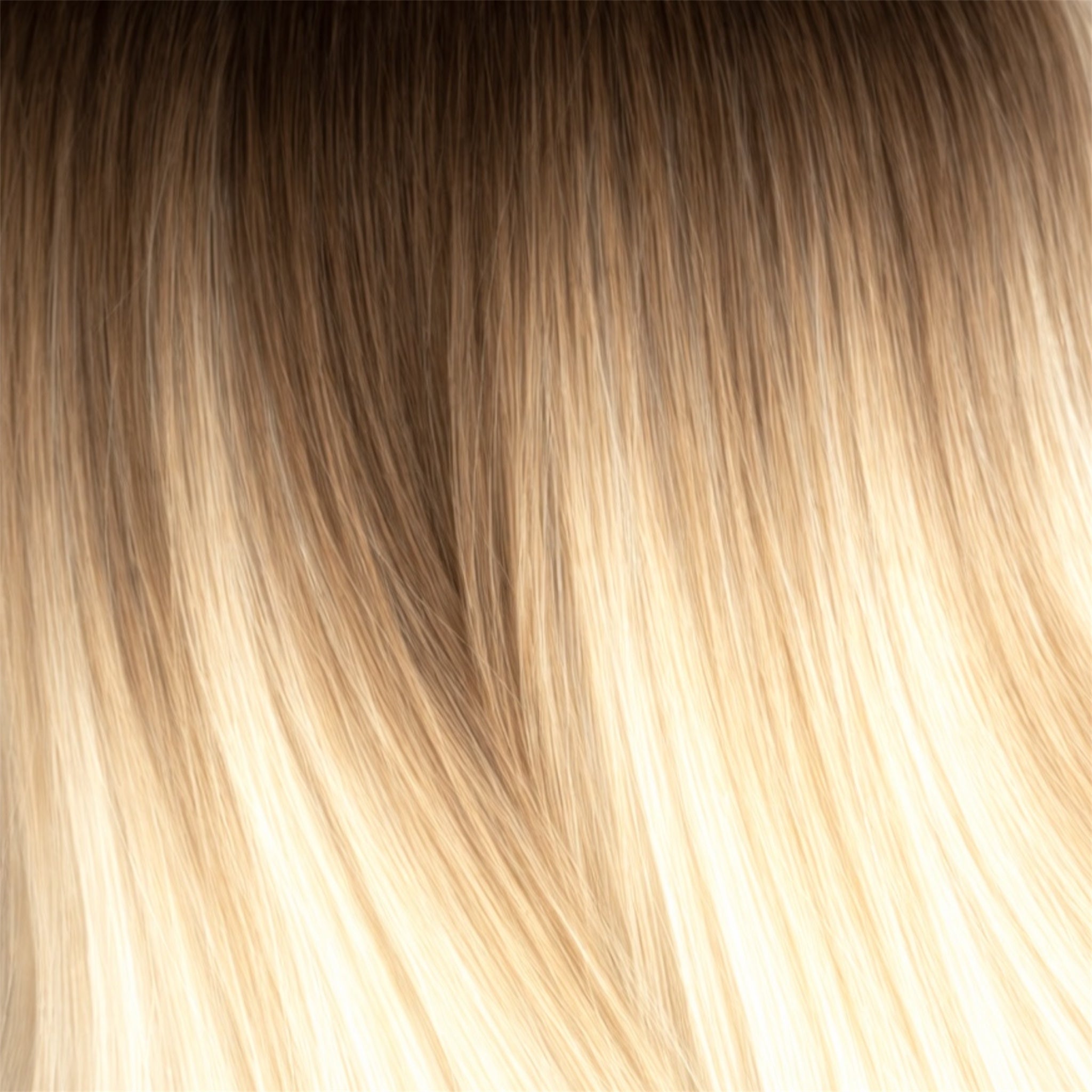 Close-up of blonde hair strands with a gradient from dark to light.